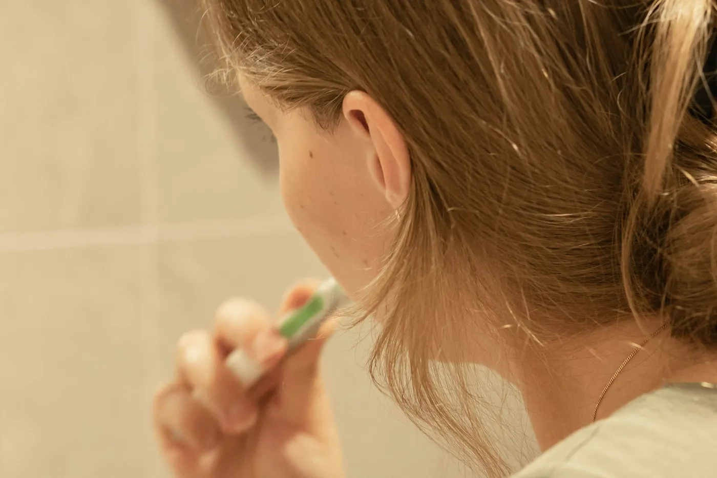 Brushing teeth in front of a mirror